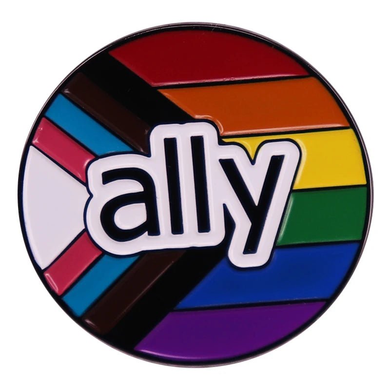 The "Ally enamel pin featuring progress pride flag" is a circular pin with "ally" over the inclusive pride design—rainbow stripes plus black, brown, light blue, pink, and white chevrons—to show LGBTQ+ support.