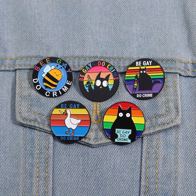 Be Gay Do Crime badge - rainbow, cats, duck, bees