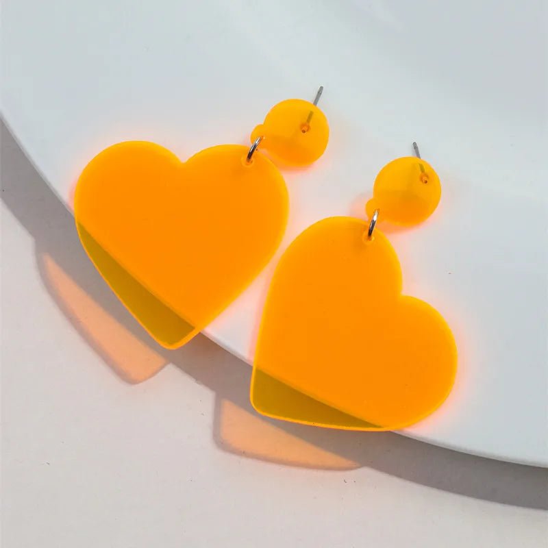 Fluro orange love heart dangling earrings
