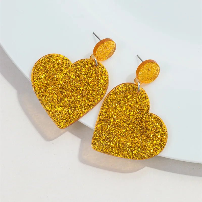 Gold glitter love heart dangling earrings