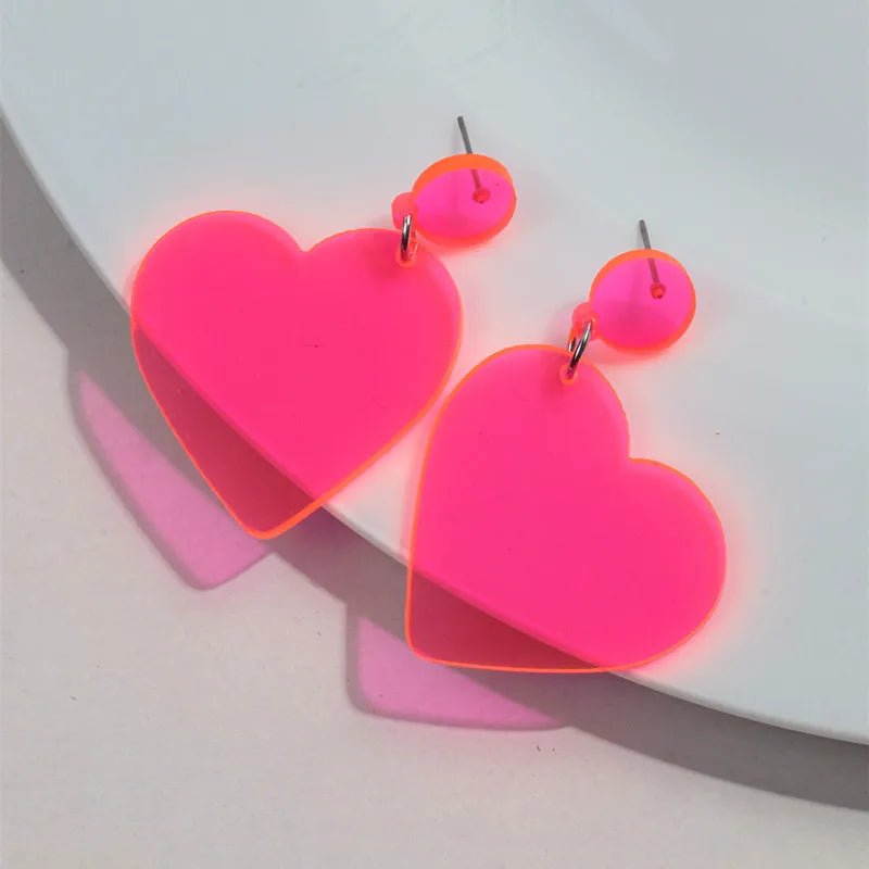 Fluro pink love heart dangling earrings
