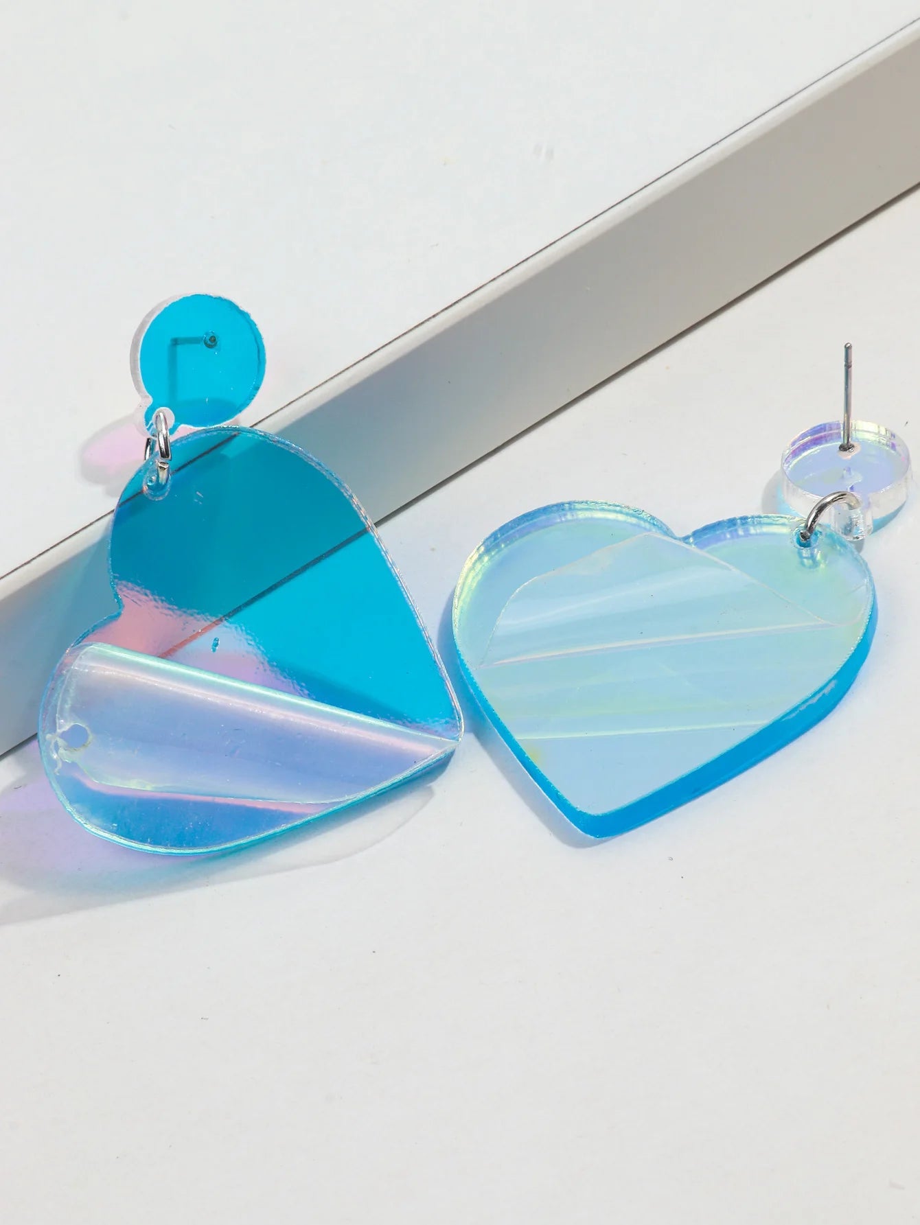 Clear blue love heart dangling earrings