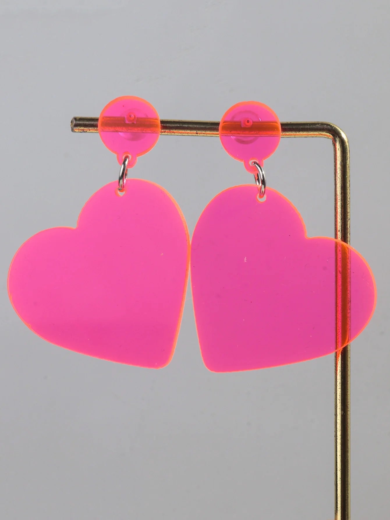 Fluro pink love heart dangling earrings