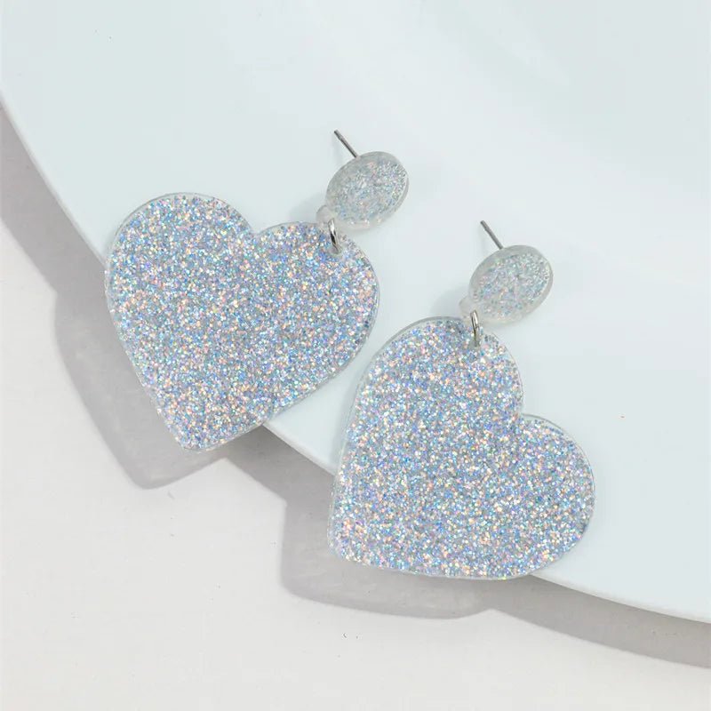 Silver glitter love heart dangling earrings