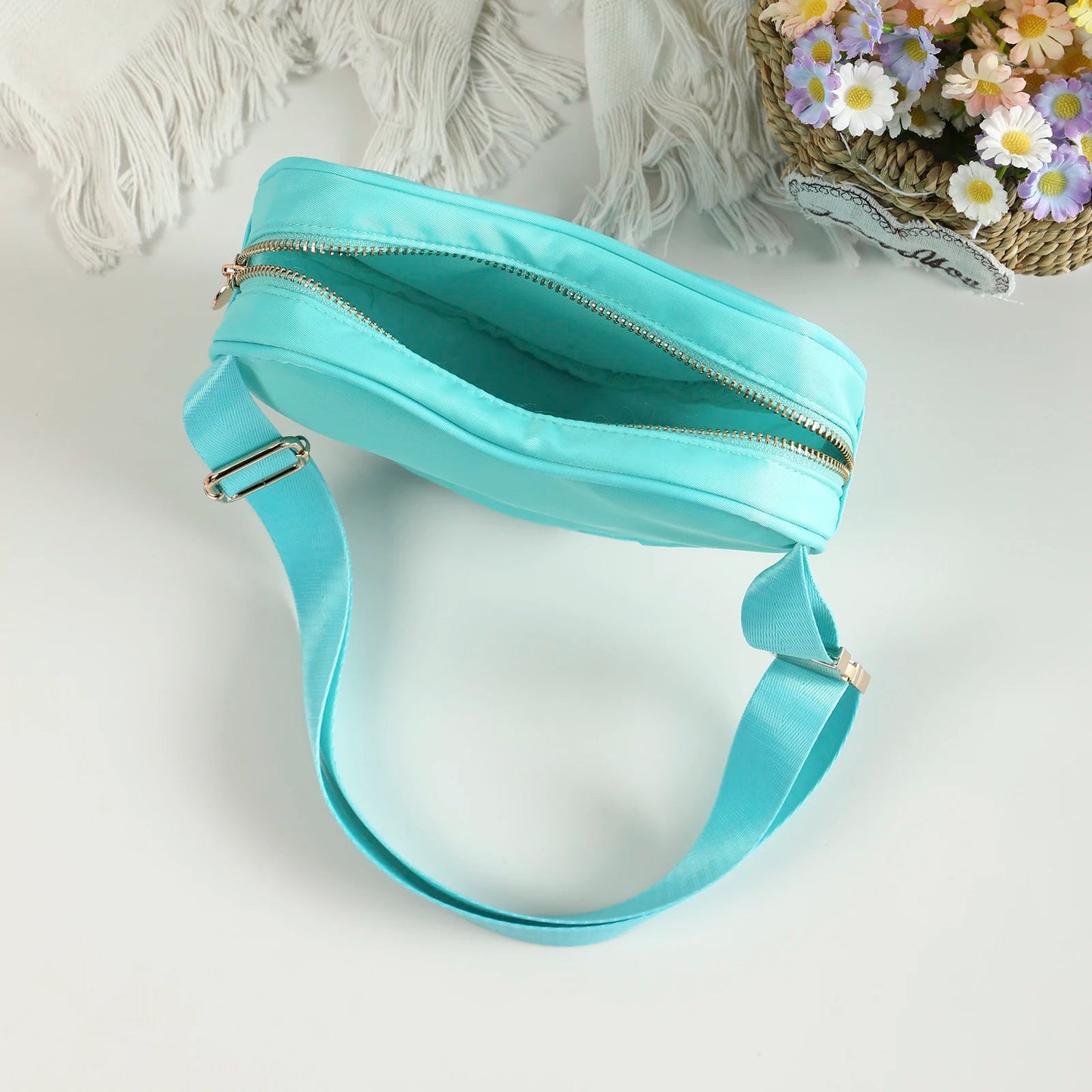 Love heart shaped bag with waist strap and gold details. This Heart Shaped Crossbody Bag or Fanny Pack is perfect for your skating adventures. Its unique love heart design is a fashionable statement piece, while the bag's practicality offers hands-free convenience. Available in kawaii shades of pink, teal, and tie dye, or make a bold statement with red.