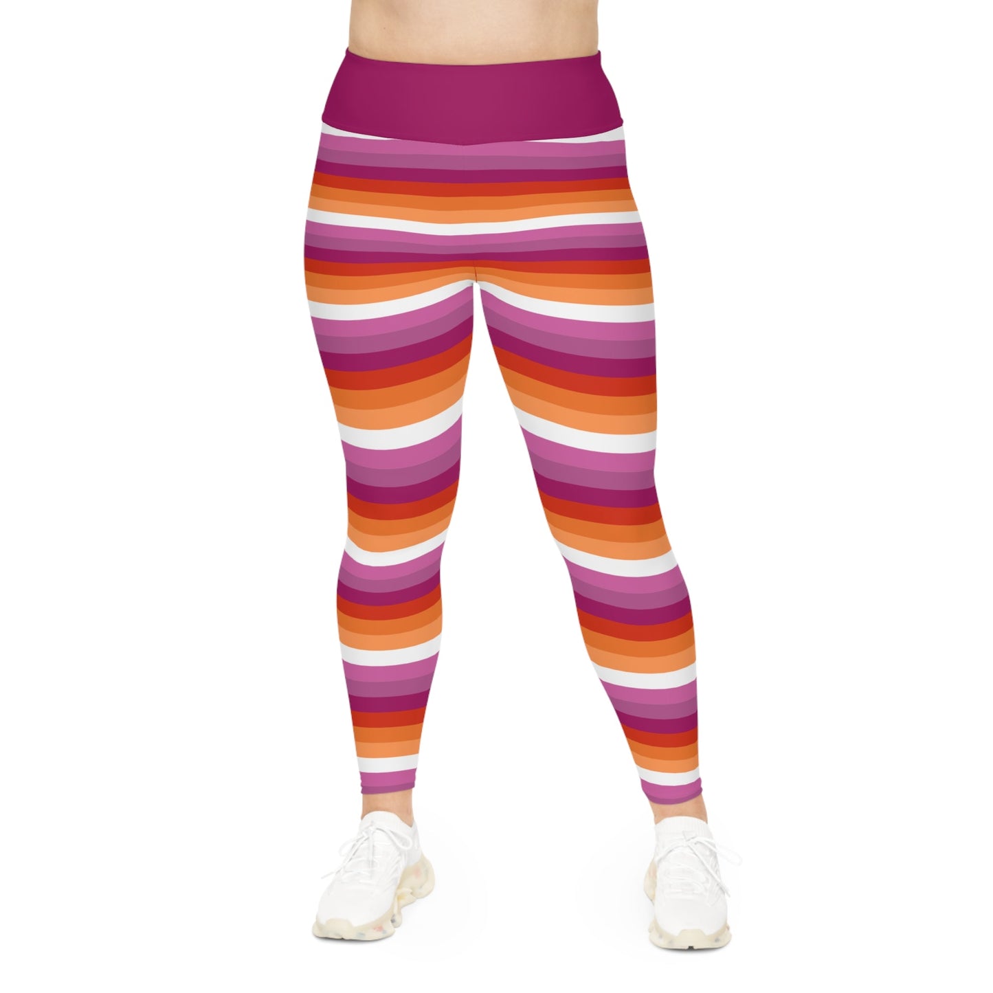 A person is sporting the vibrant Lesbian Pride Plus Size Leggings by Printify, available in sizes 2XL to 6XL, showcasing a blend of orange, pink, red, and white stripes inspired by the Lesbian Pride Flag. The high-waisted design pairs perfectly with their white sneakers against a plain white backdrop.