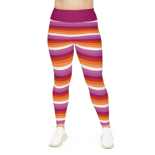 A person is sporting the vibrant Lesbian Pride Plus Size Leggings by Printify, available in sizes 2XL to 6XL, showcasing a blend of orange, pink, red, and white stripes inspired by the Lesbian Pride Flag. The high-waisted design pairs perfectly with their white sneakers against a plain white backdrop.