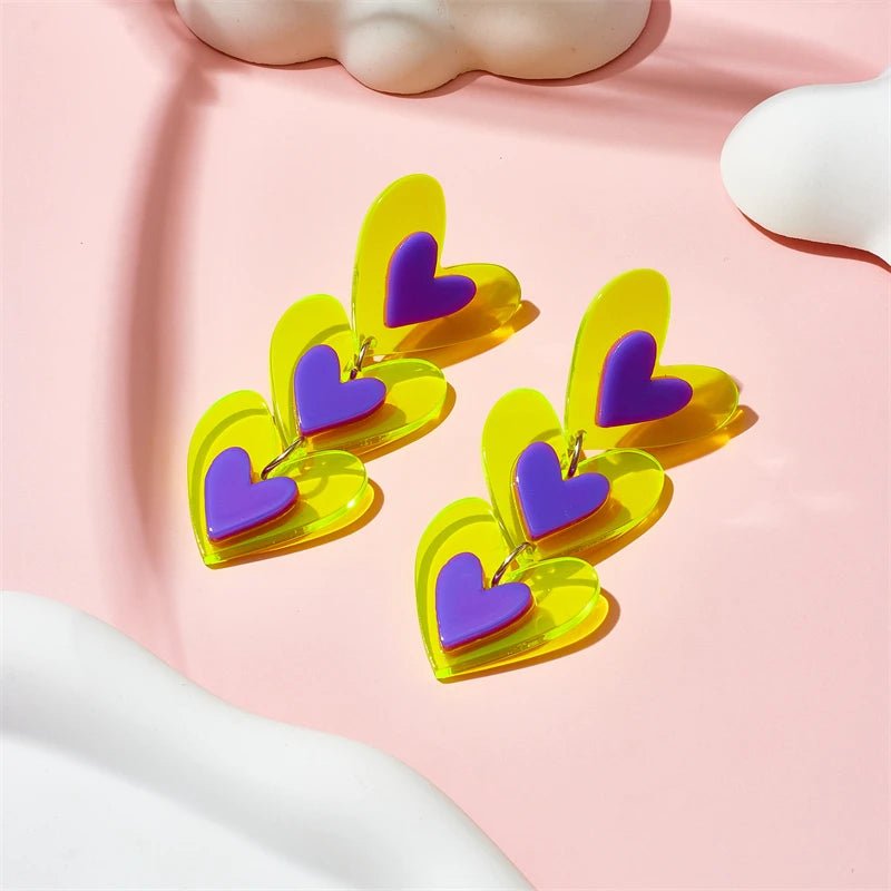 Yellow and purple heart shaped drop earrings for non-binary pride