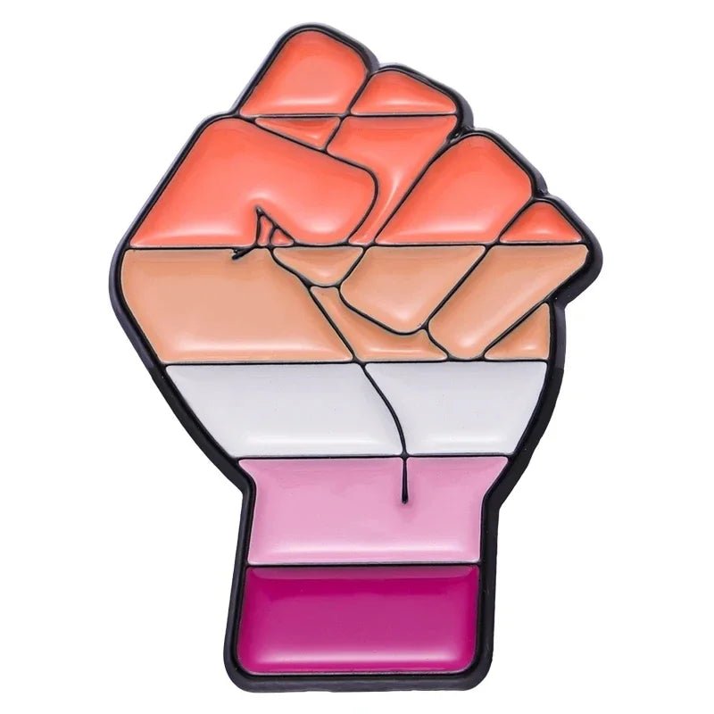 Show your pride with the Pride Flag Fist enamel pin, featuring a black-outlined fist filled with pink, white, orange, and red stripes to celebrate the lesbian pride flag and LGBTQ+ community.