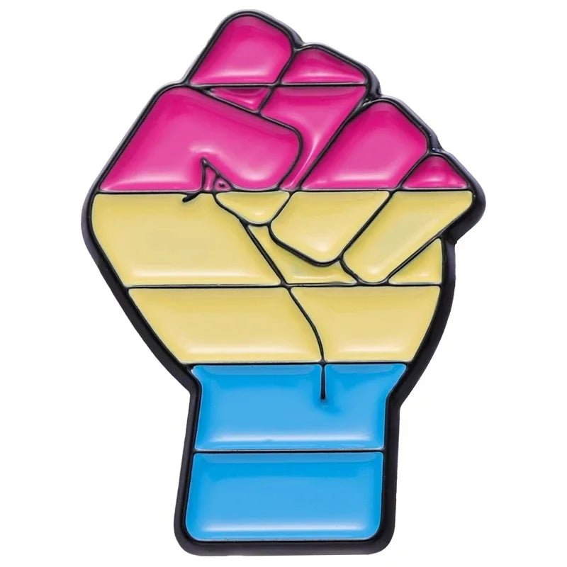 Show your LGBTQ+ pride with this Pride Flag Fist enamel pin, featuring the pansexual flag colors—pink, yellow, and blue—with a bold black outline. Part of our Pride Flag Fist enamel pins collection: Ace, Bi, Pan, Lesbian, Rainbow & Trans.