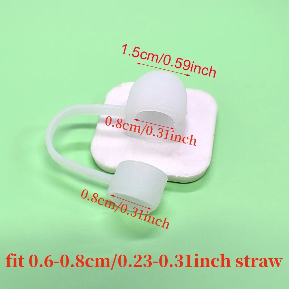 Two small white silicone caps, linked by a curved tube, rest on a white platform against a green background. The red text shows dimensions of 1.5 cm/0.59 inch and 0.8 cm/0.31 inch, fitting straws from 0.6 to 0.8 cm, resembling the Pride straw topper suited for Stanley Cup straws.