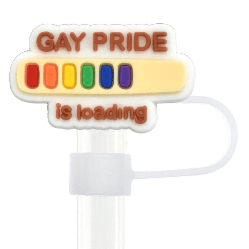 A decorative stanley cup straw reading "Gay Pride is loading" with a rainbow progress bar in red, orange, yellow, green, blue, and purple. This pride design straw topper fits Stanley Cup straws.