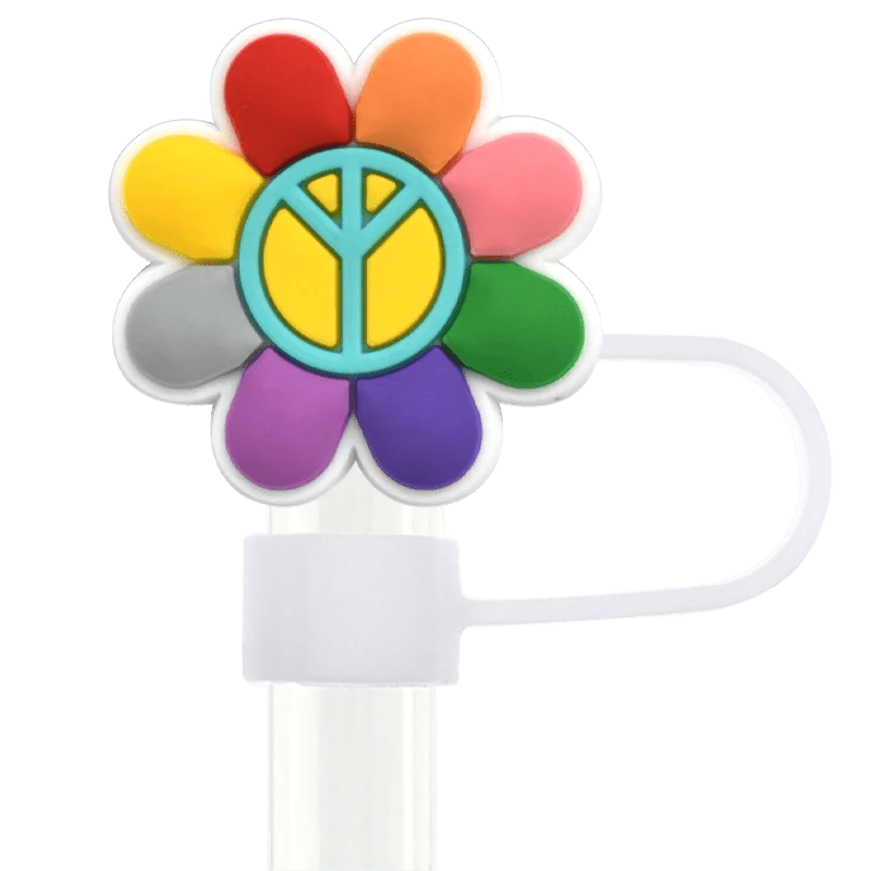 The Pride straw topper, designed for Stanley Cup straws, is shaped like a flower with red, orange, pink, light blue, purple, green, and light/dark gray petals. A blue circle with a yellow peace symbol adorns its core. It comes with a clear stick and white handle.
