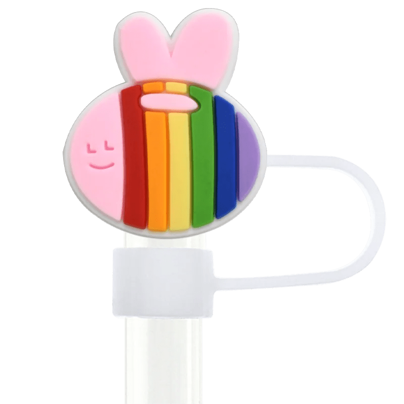 A cute, colorful bee-shaped straw topper with a rainbow body and pink wings celebrates diversity with pride designs. It's attached to a clear strap, ideal for accessorizing bags or Stanley Cup straws.