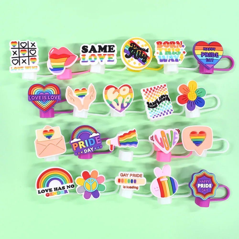A collection of colorful pride-themed straw toppesr ofeaturing rainbows, hearts, and phrases like "Pride Day," "Love is Love," and "Born this Way" celebrates LGBTQ+ pride. Check out our Pride straw topper that fits Stanley Cup straws for a matching accessory!.
