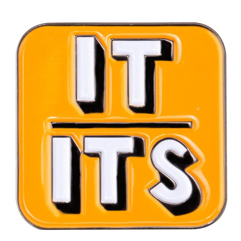 A vibrant yellow enamel badge from Gay Skate's Pronoun Pin series features raised white and black letters, boldly displaying "IT" over "ITS," separated by a sleek horizontal line. Non-binary badge