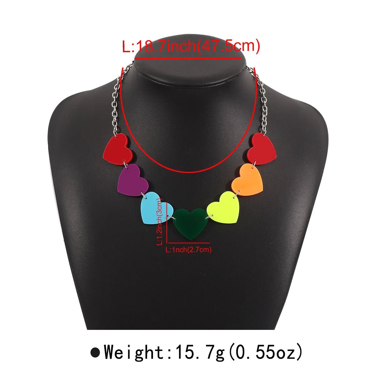 The Rainbow Pride Acrylic Necklace features seven colorful hearts on a silver chain—an ideal unique pride accessory. Shown on a black bust with measurements and weight in red and black text. Three designs available.