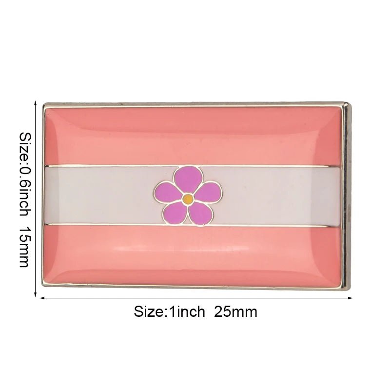 The Rare Pride Flags enamel lapel pin features a pink and white rectangular design with a central purple flower. Measuring 1 inch by 0.6 inches (25mm by 15mm), this pin subtly celebrates LGBTQ+ unity and expression.