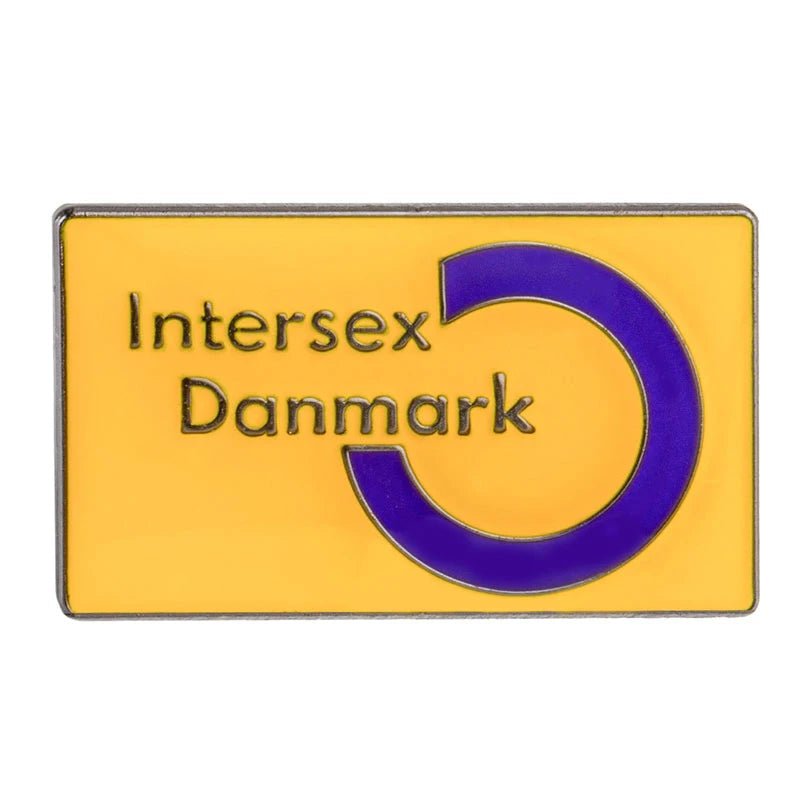 This yellow enamel lapel pin, featuring a purple circle on the right and "Intersex Danmark" at its center, is part of the Rare Pride Flags collection. It's perfect for proudly displaying your support for Inclusive Pride.
