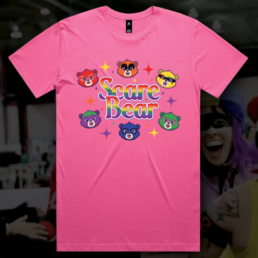 The SCARE BEAR fundraiser tee is a locally hand-printed pink shirt with “Scare Bear” in bold, five colorful bear faces, and star sparkles—perfect for roller derby or your next GAY SKATE event.