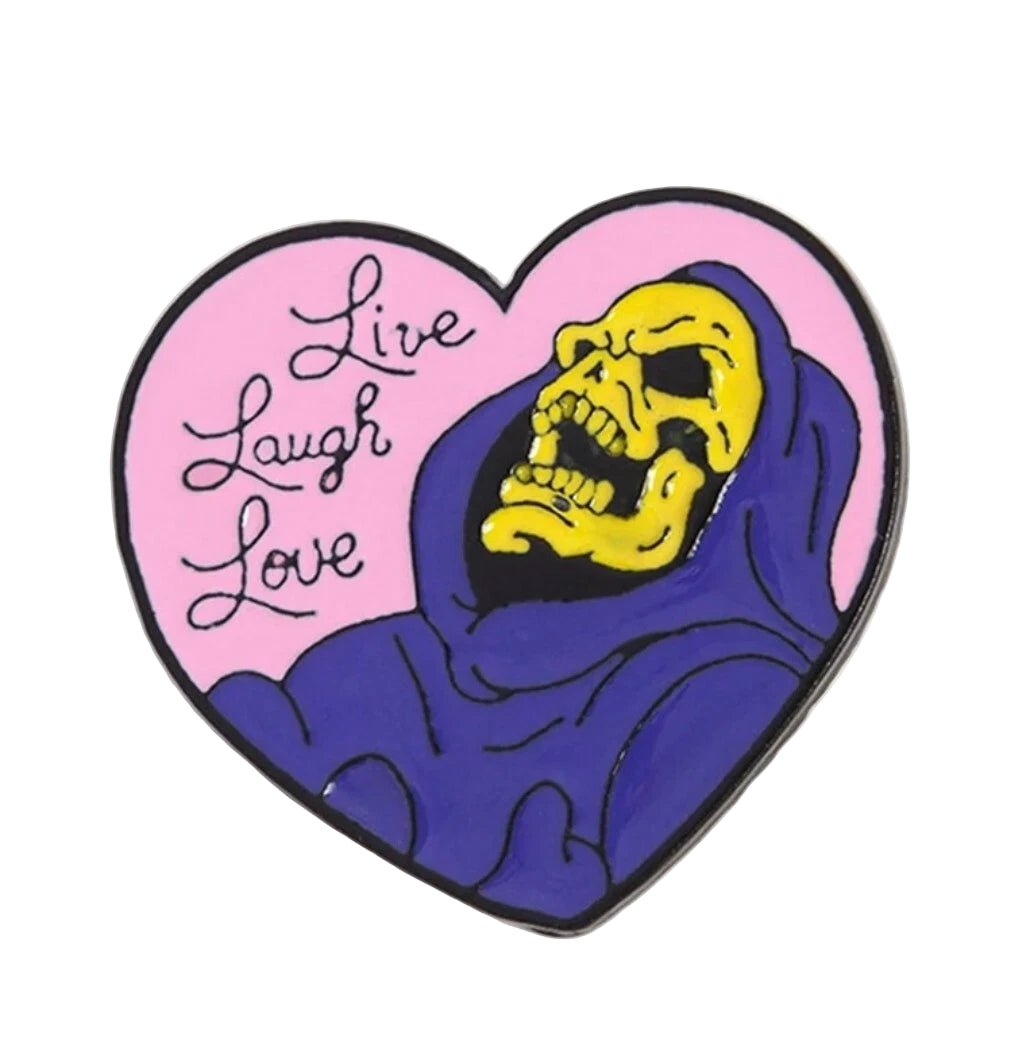 Heart-shaped badge with Skeletor laughing skull design and 'Live Laugh Love' text
