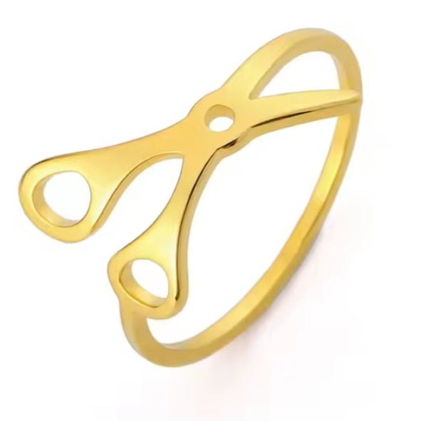 The Stainless Steel or Gold Scissor Ring celebrates Sapphic, WLW, and Lesbian Pride with an open scissor design. Crafted from stainless steel or gold, it features finger holes and blade details, displayed on a white background.