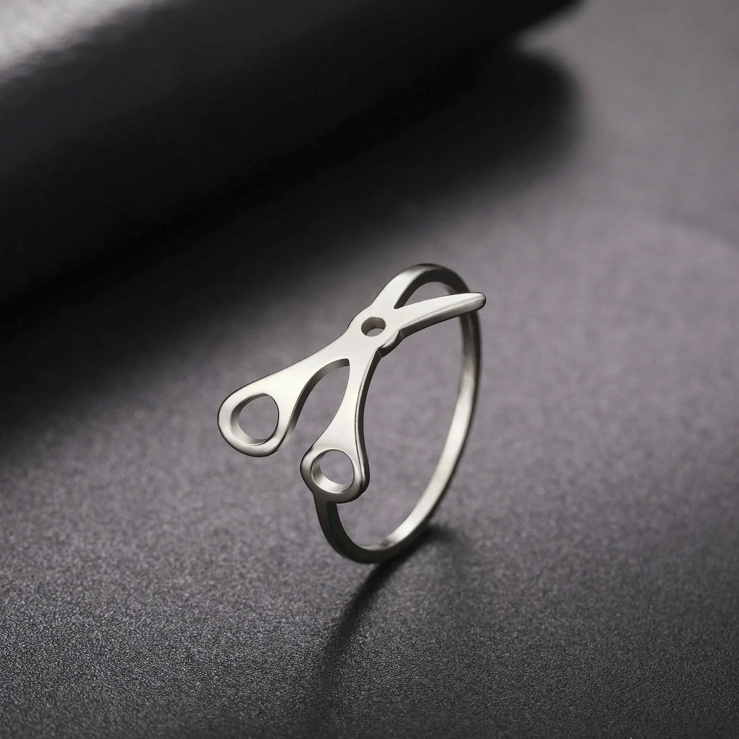 The Stainless Steel or Gold Scissor Ring—Sapphic, WLW, and Lesbian Pride—is uniquely designed to resemble a pair of scissors, making it a perfect accessory for those seeking distinctive sapphic pride jewelry.