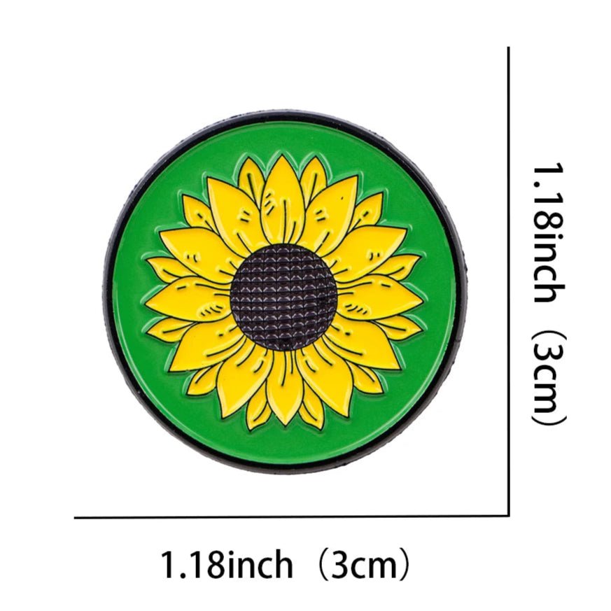 Circular green badge with a yellow sunflower design representing hidden disability, chronic illness, neurodiversity