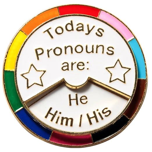 Today's pronouns are: he him his, she her hers, they them theirs. Rainbow 360 rotating metal pronoun badge