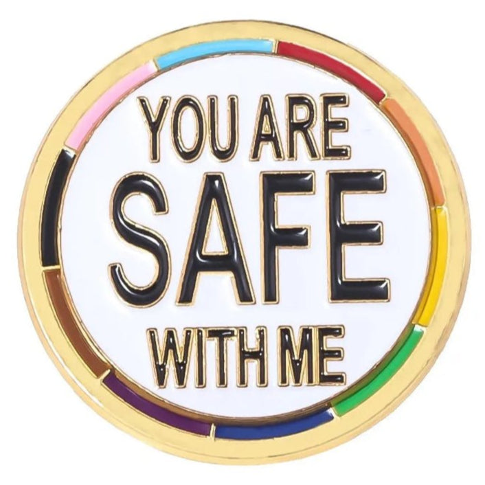 The "You Are Safe With Me - progress pride and gold round pin" features rainbow accents and a bold message, making it a supportive addition to Ally pride accessories.