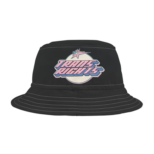 The Trans Rights Black Bucket Hat by Printify features a pastel design of the words "Trans Rights" in a futuristic font, centered in front of a rainbow-colored circle. Made from 100% polyester and available in two sizes, this black bucket hat promises both style and comfort.