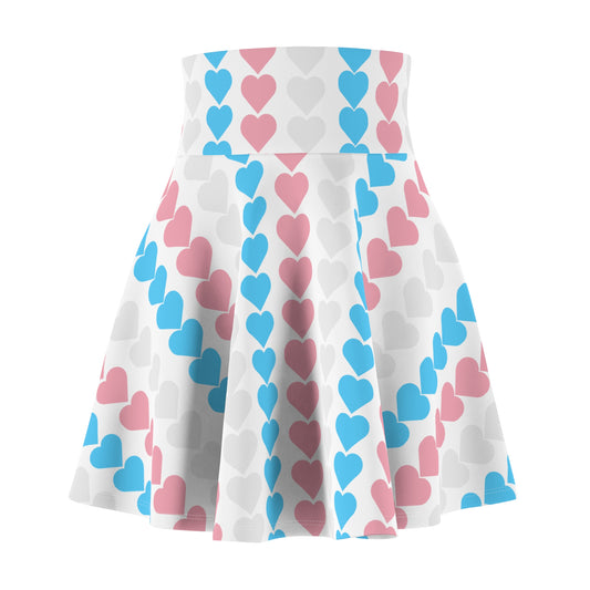 The Trans Flag Love Hearts Skater Skirt is a versatile high-waisted skirt, featuring a white background adorned with vertical rows of alternating blue pink and white hearts. Perfect for any occasion, this stylish skater skirt combines comfort and charm effortlessly.