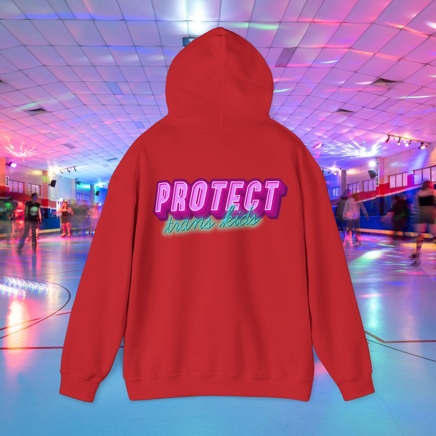 The Protect Trans Kids Hoodie, made from ethically grown cotton, features bold, colorful lettering. Perfect for a vibrant roller skating rink setting with joyful skaters. Available for Australian shipping.