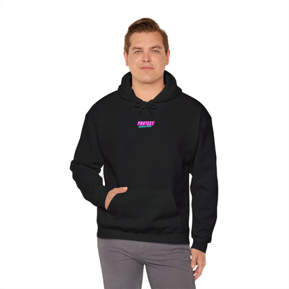 A man models the "Protect Trans Kids Hoodie - Australian Shipping," featuring "PROTECT" in vibrant purple and pink. He stands confidently against a white background, wearing gray pants, with one hand in his pocket, highlighting the ethically crafted black hoodie.