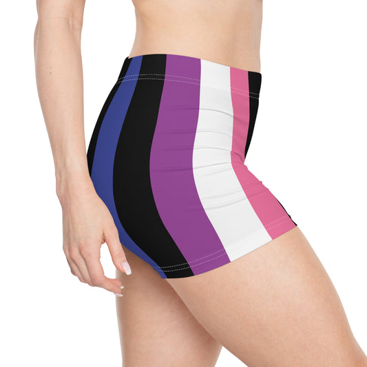 A person wearing Printify's Genderfluid Pride Flag Short Shorts, which showcase the pride flag colors in dark pink, white, purple, black, and blue vertical stripes. Only the torso, hips, and upper thighs are visible against a white background.