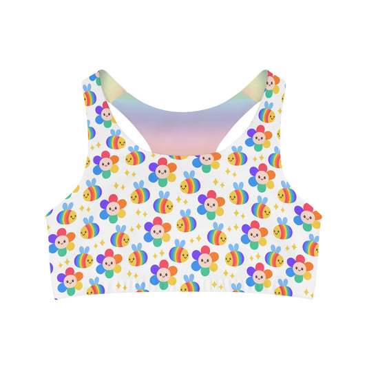 Explore the Rainbow Subtle Pride seamless sports crop by Printify, featuring a whimsical design of cartoon flowers and smiling faces complemented by vibrant rainbow accents. This LGBTIQAP+ active wear piece includes small yellow stars on a white backdrop, ensuring comfort with its stretchy fabric.