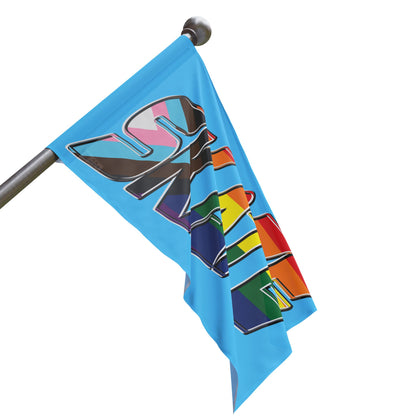 The "SKATE progress pride original logo flag - blue" by Printify features a light blue polyester organza material. The word "SKATE" is prominently displayed in large, bold letters, with each letter filled using segments of various LGBTQ+ pride flags, including the rainbow pride flag and the progress pride flag, celebrating queer skating pride.