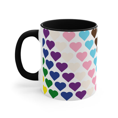 Introducing the Progress Pride Flag Love Hearts - Colourful Accent Mug by Printify: a ceramic mug featuring a vibrant red handle and a lively interior, adorned with diagonally arranged rows of hearts in shades of purple, blue, pink, green, and yellow. The hearts are evenly spaced across the surface, creating a charming and festive design.