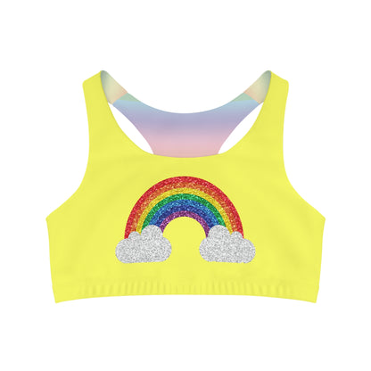 Discover the vibrant yellow seamless sports crop from Printify, featuring a glittery rainbow and clouds design on the front. This LGBTIQAP+ active wear piece showcases racerback straps with a subtle gradient, embodying pride in every detail.