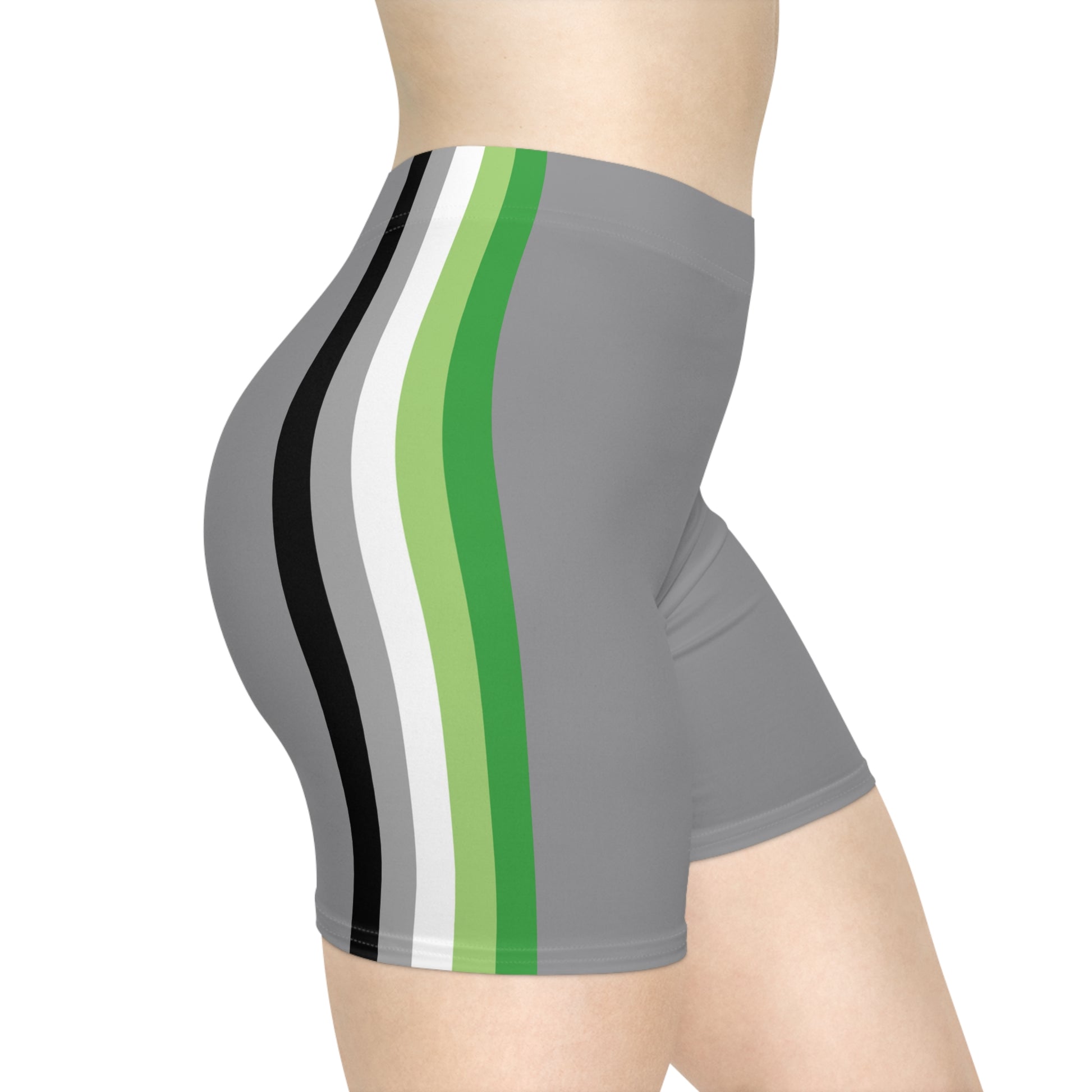 A person is wearing Aromantic Pride Flag Bike Shorts, featuring gray shorts with vertical stripes in black, white, dark green, and light green on the side. The photo focuses on their lower torso, buttocks, and upper portion of the legs, highlighting the moisture-wicking fabric of the shorts.