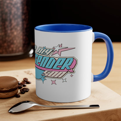 The vibrant I Love My Transgender Son original design accent mug from Printify features a colorful interior and showcases a retro-styled graphic with the phrase "Love My Transgender Self" in bold letters, surrounded by star shapes and a banner. The design incorporates pastel colors such as pink, turquoise, and blue.