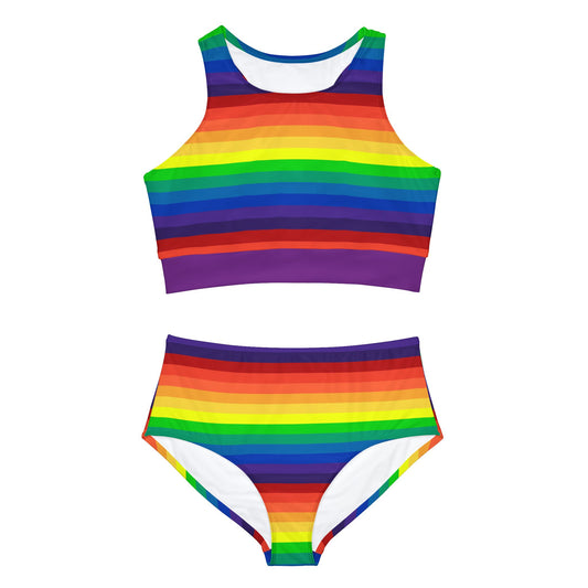 A two-piece "Sporty Swim or Activewear Set - Rainbow Pride Flag"  lays flat against a white background. It features horizontal rainbow stripes in vibrant colors such as red, orange, yellow, green, blue, and purple. The top boasts a high neckline while the bottom has a flattering high-waisted cut. Perfect for pride month, festivals, the beach, resort wear, pole dance, clubs and roller derby