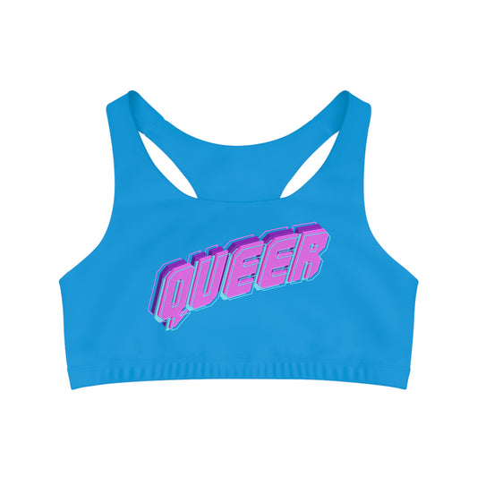 The Blue QUEER logo seamless sports crop from Printify stands out with the word "QUEER" in bold, pink 3D letters on the front, offering a vibrant and dynamic look. Crafted with moisture-wicking fabric and featuring a racerback design, this piece of LGBTIQAP+ activewear ensures both performance and style.