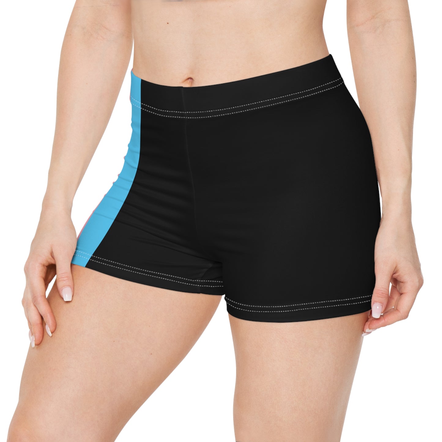 A person wearing Printify's Transgender Pride Flag Short Shorts, which feature the horizontal stripes of light blue, pink, white, pink, and light blue from the transgender pride flag. Made from a moisture-wicking polyester spandex blend, these high-waisted shorts reveal the person's bare midriff and upper thighs.