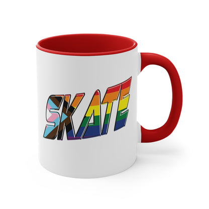 The SKATE progress pride flag accent mug by Printify features a white coffee mug with a red handle and a colorful interior. The front boldly displays the word "SKATE" in rainbow colors, including shades of blue, pink, white, and brown.