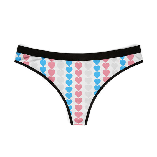 The Trans Pride g-string or thong panties features an original design with vertical stripes of hearts in blue, pink, and white, echoing the colors of the Trans Pride Flag. The waistband and leg openings are elegantly trimmed in black. The back is striped in the transgender pride flag. Perfect gift for transwomen and t4t romance.