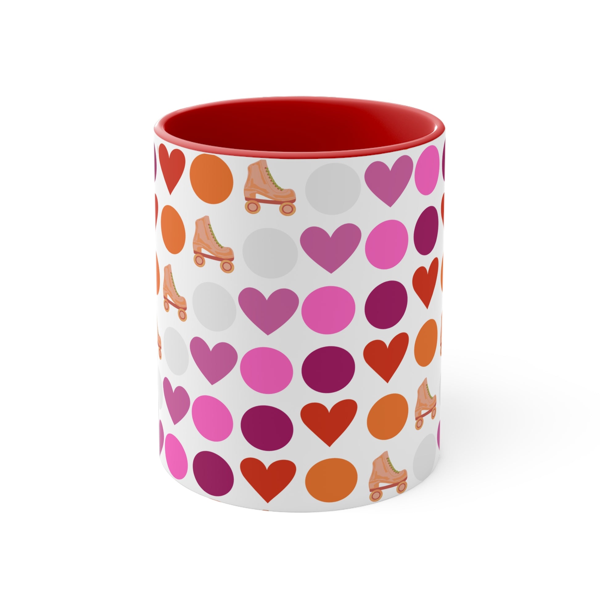 The Subtle Lesbian Pride + Roller Skate Colourful Accent Mug by Printify is a white ceramic mug featuring a red handle and a vibrant interior. It is adorned with a playful pattern of hearts, circles, and roller skates in an array of colors, including pink, purple, orange, and red.