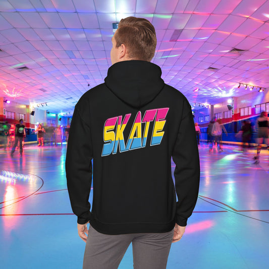 A person wearing a high-quality SKATE Pansexual Pride Hoodie by Printify, featuring the word "SKATE" in large, colorful letters, stands in a vibrant roller skating rink. The unisex heavy blend hoodie is part of a trans and queer-owned brand. The rink is decorated with colorful lights, and people are skating in the background as the person faces away from the camera.