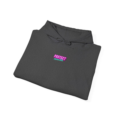 A folded dark gray "Protect Trans Kids" hoodie, made from ethically grown cotton with a vibrant pink and green "PROTECT" logo on the chest, features drawstrings and is neatly displayed on a white background.