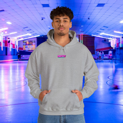 A person wearing a "Protect Trans Kids" unisex gray hoodie stands in an indoor roller-skating rink, bathed in vibrant neon lights. The cozy sweatshirt adds warmth as blurred skaters glide by, creating a lively scene.